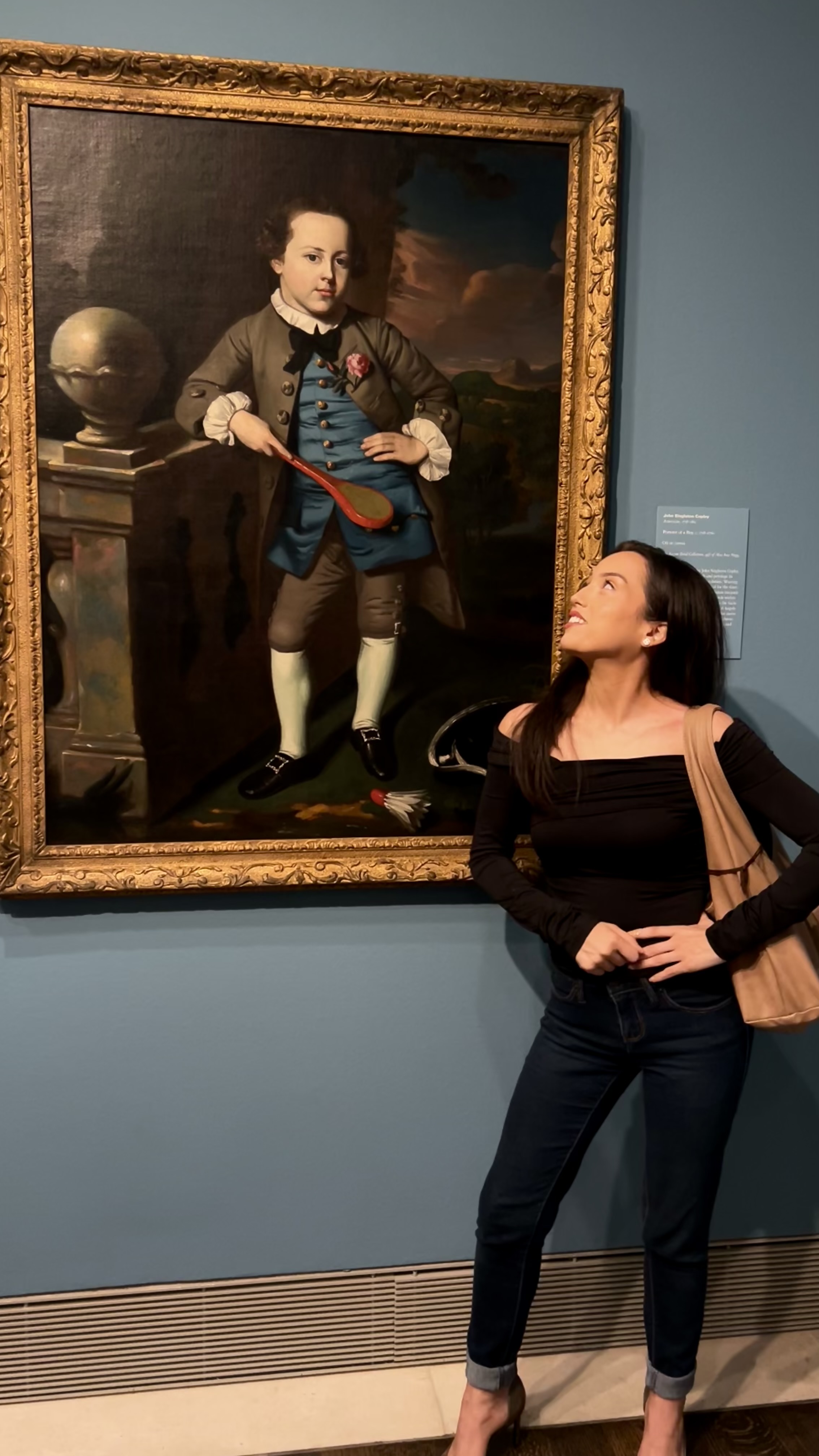 Christi standing beside John Singleton Copley's Portrait of a Boy at MFAH.